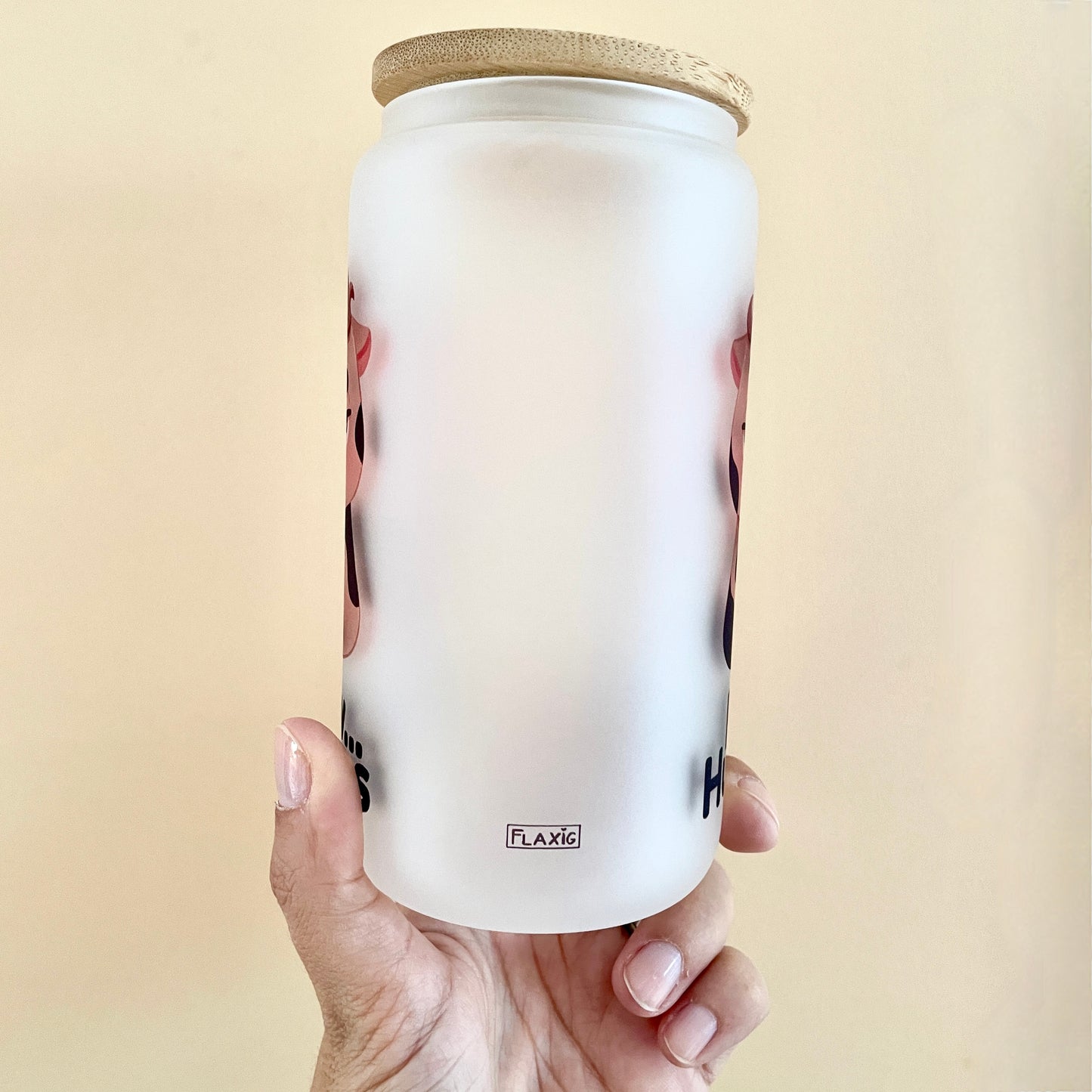 Glass with bamboo lid and straw